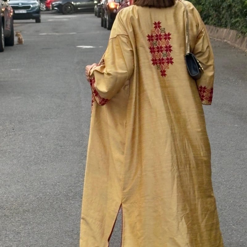 Elegant raw silk abaya featuring timeless Palestinian embroidery